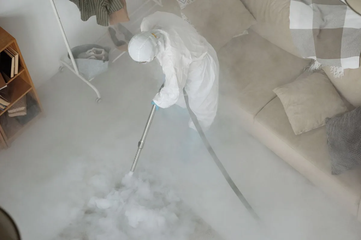 Biohazard cleanup technician in protective equipment, Marshfield, WI